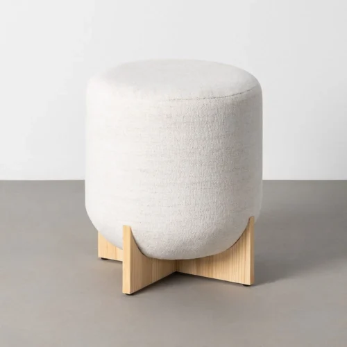 Pouf rond tissu crème piètement en croix Ixia Ø 40 cm